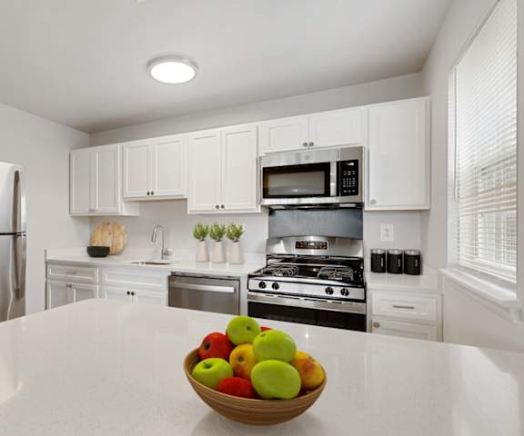Kitchen with White Cabinets at Kenilworth at Perring Park Apartments, Parkville