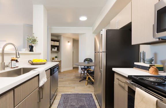 a kitchen and dining area in a 555 waverly unit