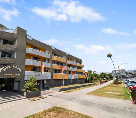 A large apartment complex with a sign that reads "Whistl Ford Apartments".