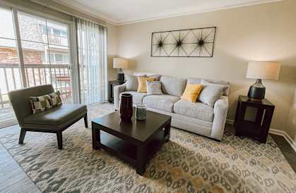 a living room with a couch and a table
