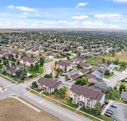 A suburban neighborhood with houses and roads.