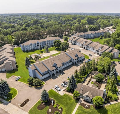 A bird's eye view of a residential area with houses and trees.