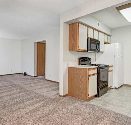 Connected livingroom and kitchen at apartment in Derby, KS