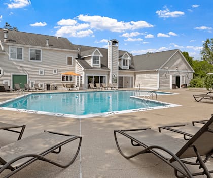 A large house with a pool in the backyard.