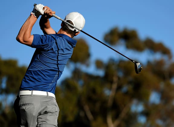person hits his tee shot on the fifth hole during the third round of the golf tournament at Village Greens of Queen Creek
