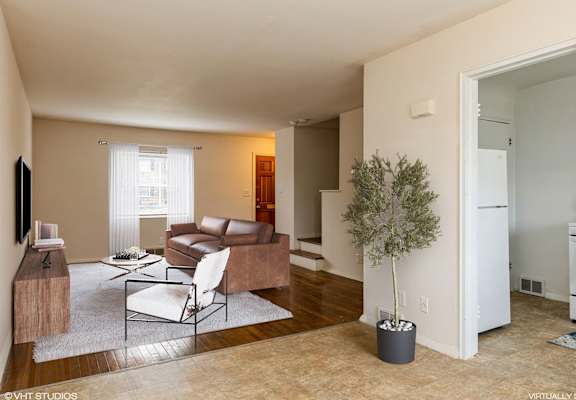 a living room with a couch and a chair
