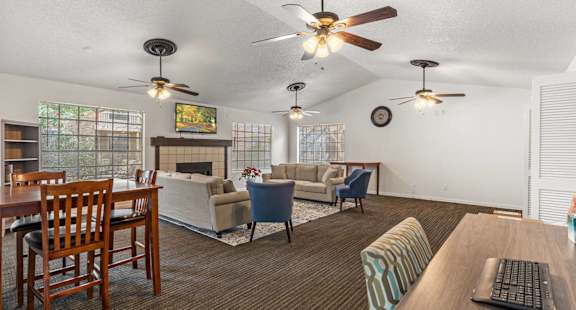 a living room and dining room with couches and a table