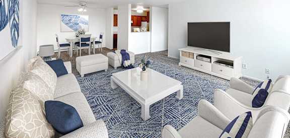 a living room filled with furniture and a flat screen tv