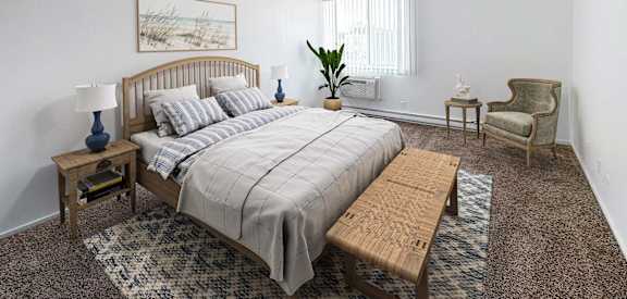 a bedroom with a bed and a chair