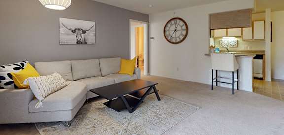 a living room with a couch and a table