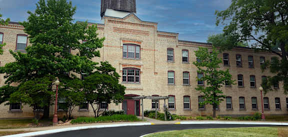 a brick building with a silo on top