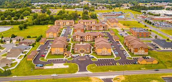 A large housing complex with a central courtyard surrounded by roads.