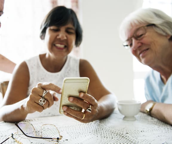 Senior Friends Checking Out Phone | Camino Al Oro Senior in  Los Angeles, CA 90031