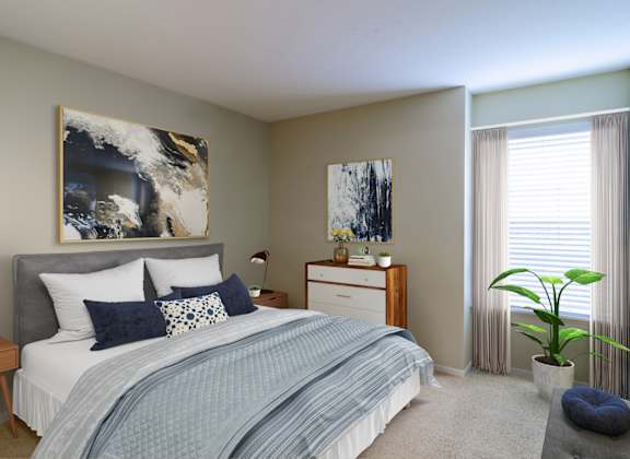 a bedroom with a bed and a dresser and a window
