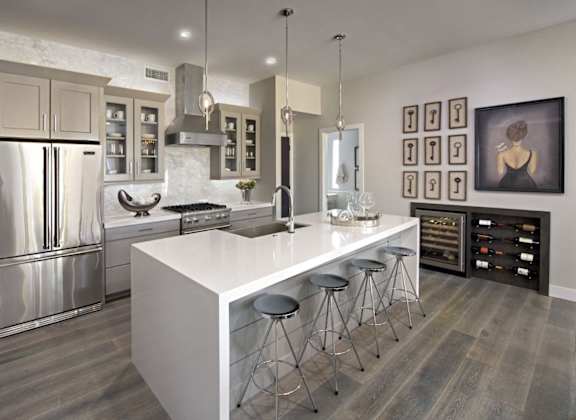 a kitchen with a large island and stainless steel appliances at Novella Arcadia, Phoenix