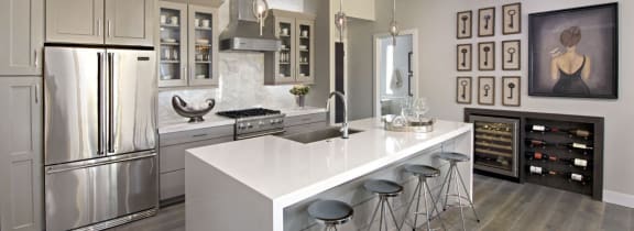 a kitchen with a large island and stainless steel appliances at Novella Arcadia, Phoenix, 85018