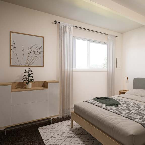 A room with a window and a carpeted floor.