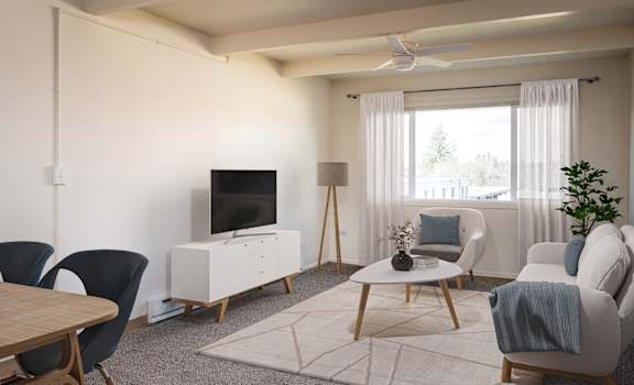 A living room with a television, chairs, and a table.