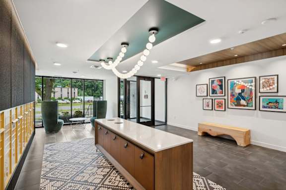 a living room with a kitchen and a sliding glass door