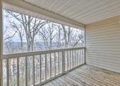 Thumbnail 19 of 28 - A balcony with a view of trees and houses at Landmark at Lyncrest Reserve Apartments, Nashville, TN, 37209
