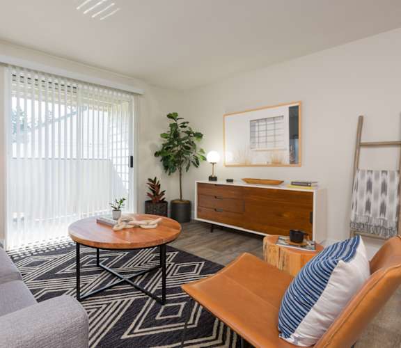 Living room with a gray couch and a wooden coffee table at Brookside 112, 98682