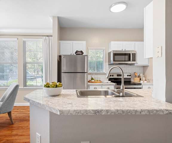 a kitchen with a granite counter top and a sink at Sweetgrass Landing, Mount Pleasant, 29466