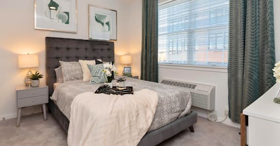 a bedroom with a bed and a window