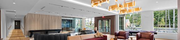 Hamilton at Eagleview lobby with comfortable seating and beautiful light fixtures at Hamilton at Eagleview, Pennsylvania