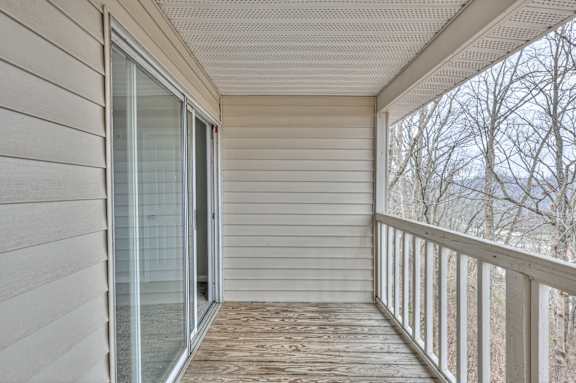 A balcony with a glass door and a wooden floor at Landmark at Lyncrest Reserve Apartments, Nashville, TN, 37209