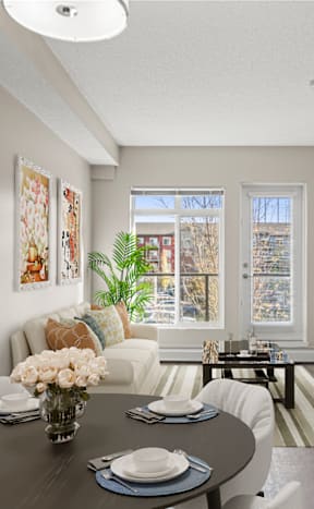 an open living room and dining room with a table and chairs