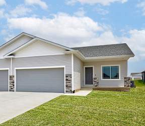 A two-car garage is attached to a house. at Two Rivers Home Rentals, West Des Moines