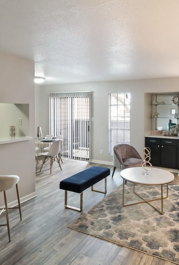 a living room with a couch and a table at Seacrest Apartments, Garland, 75044