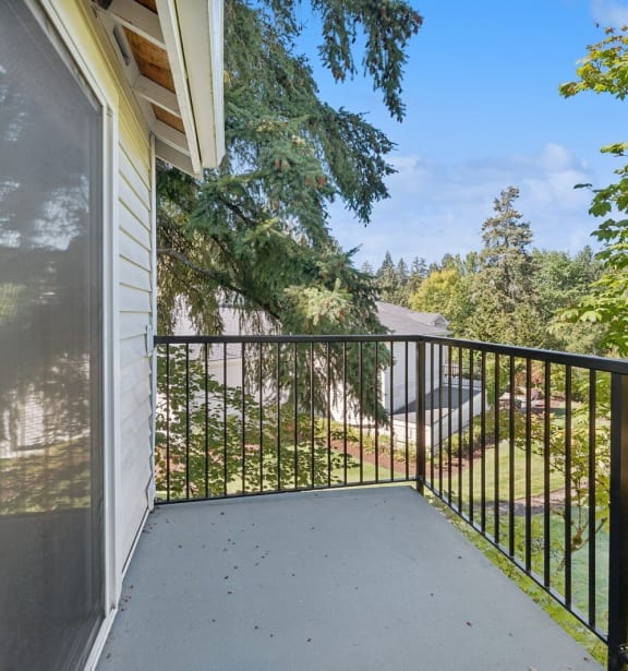 a patio with tables and umbrellas and a fire pit at Murrayhill Park, Oregon, 97008