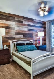 Bedroom with cozy bed and lamps at Villa Serena, Henderson 89014