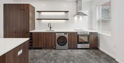 a kitchen with a stove top oven next to a sink