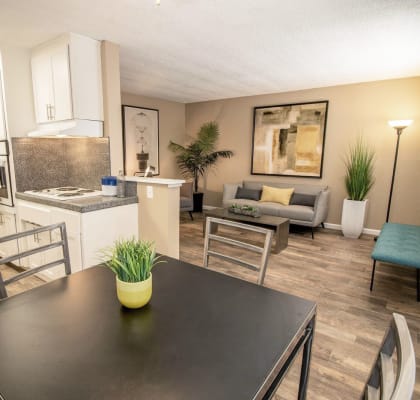 a kitchen and dining room with a table and chairs at Woodland Village Apartments , Woodland California