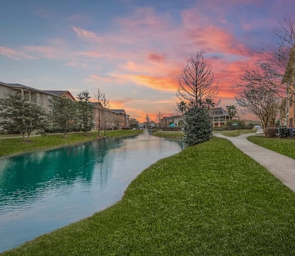 A serene residential area with a river running through it.