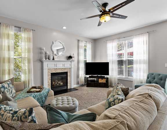 a living room with a large couch and a fire place