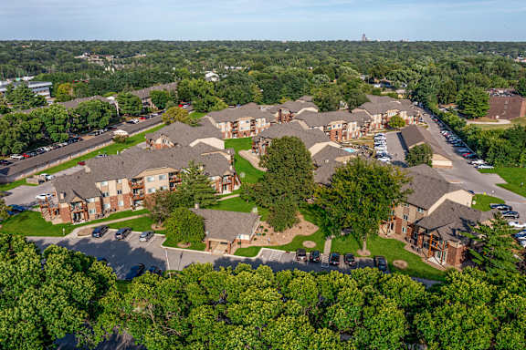 A bird's-eye view of Regency Woods, featuring the community buildings and natural landscape.