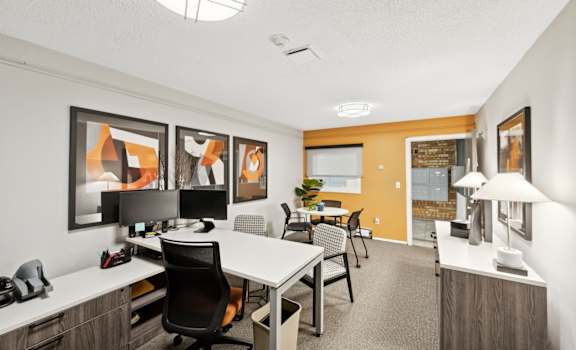 the preserve at ballantyne commons cyber office area with desks and chairs and tables