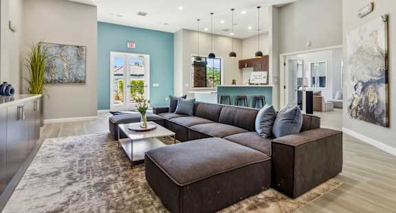 a living room with a large couch and a table