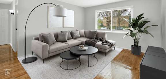 a living room with a couch and a table