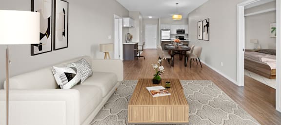 a living room and dining room with a couch and a table