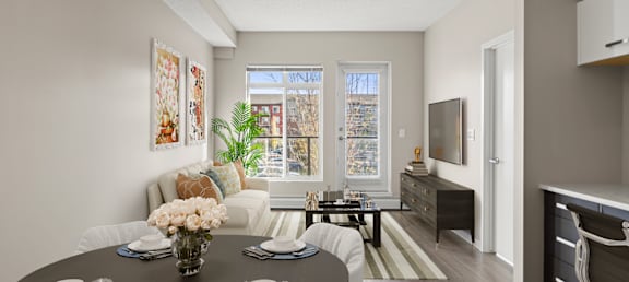 an open living room and dining room with a table and chairs
