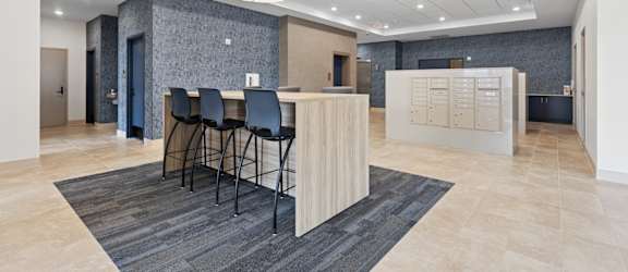A reception area with a bar and chairs.