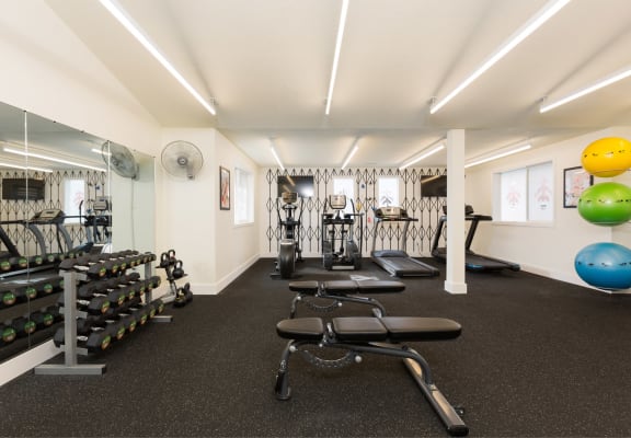 Gym with weights and other exercise equipment at Cedar House, Vancouver, WA