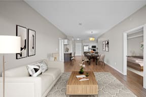 a living room and dining room with a couch and a table