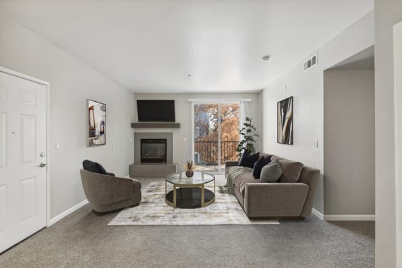Open floor plan living and dining room at Marina Village Apartments in Spark, NV