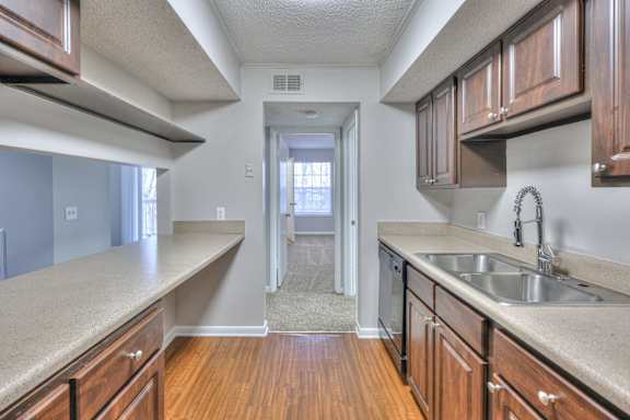 A kitchen with wooden cabinets and a sink. at Landmark at Lyncrest Reserve Apartments, Nashville, TN, 37209