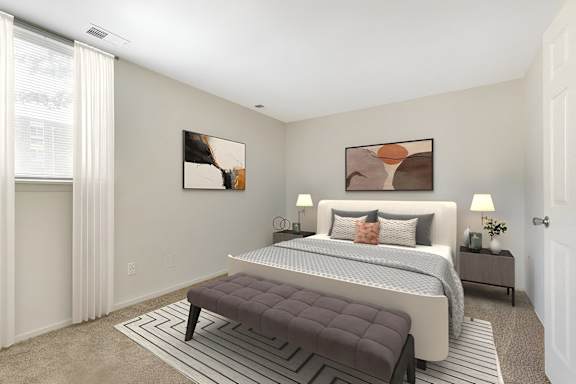 a bedroom with a bed and a rug at Copper and Quarry Village, Pikesville, MD, 21209